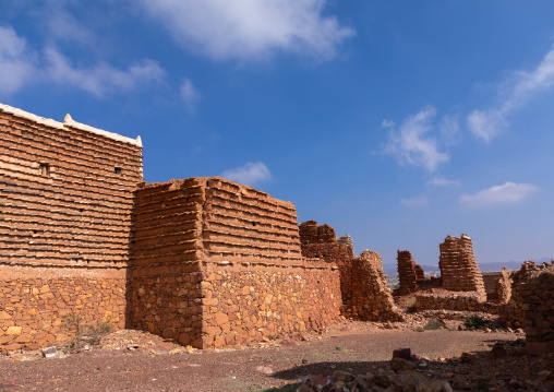 Red stone and mud houses with slates in a village, Asir province, Sarat Abidah, Saudi Arabia