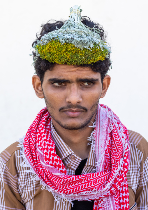 Portrait of a flower man wearing a floral crown on the head, Jizan Province, Addayer, Saudi Arabia