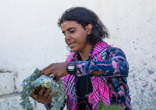 Portrait of a flower man making a floral crown on his head, Jizan Province, Addayer, Saudi Arabia