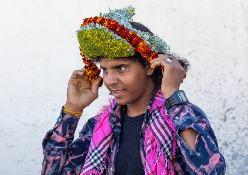 Portrait of a flower man making a floral crown on his head, Jizan Province, Addayer, Saudi Arabia