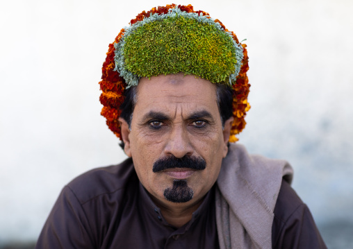 Portrait of a flower man wearing a floral crown on the head, Jizan Province, Addayer, Saudi Arabia