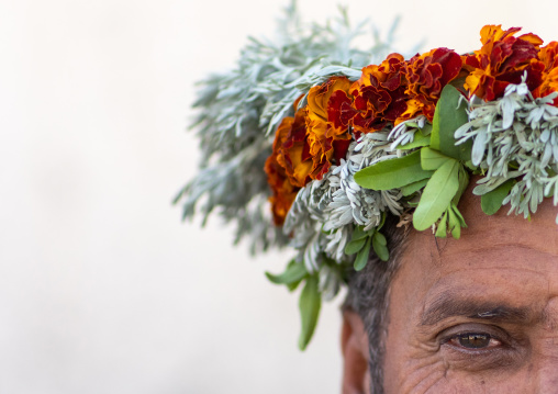 Portrait of a flower man wearing a floral crown on the head, Jizan Province, Addayer, Saudi Arabia