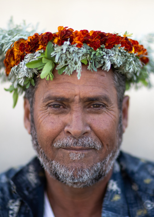 Portrait of a flower man wearing a floral crown on the head, Jizan Province, Addayer, Saudi Arabia