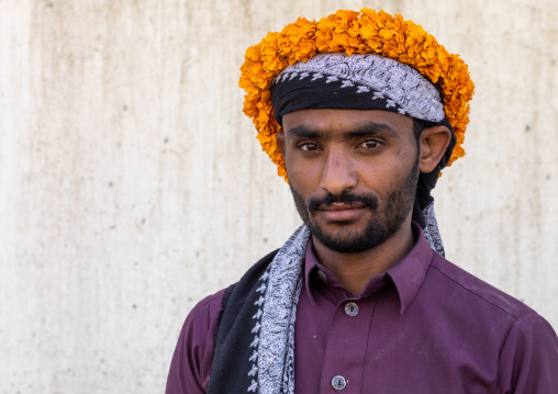 Portrait of a yemeni refugee wearing a floral crown on the head, Jizan Province, Addayer, Saudi Arabia