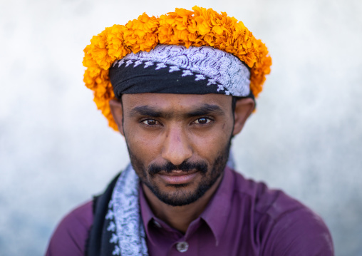 Portrait of a yemeni refugee wearing a floral crown on the head, Jizan Province, Addayer, Saudi Arabia
