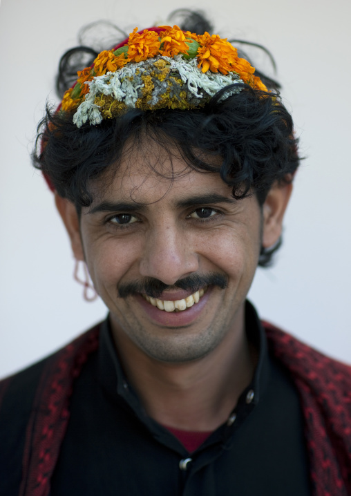Portrait of a flower man wearing a floral crown on the head, Jizan province, Addayer, Saudi Arabia