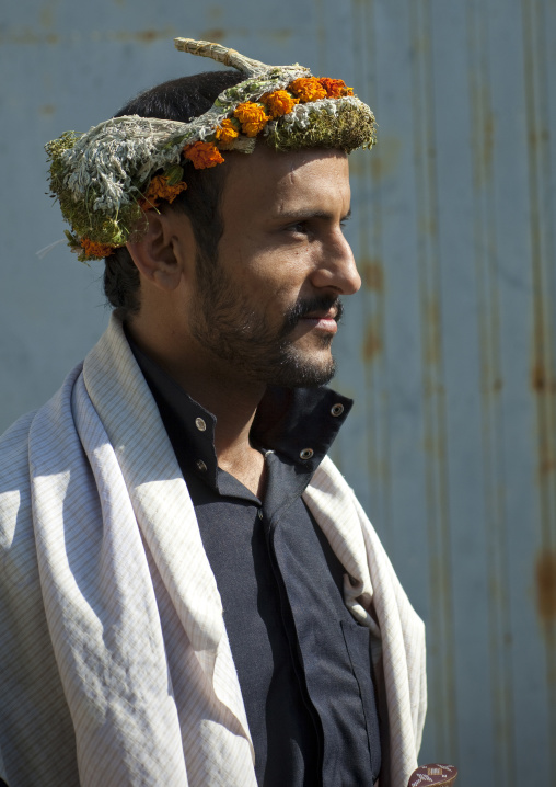 Portrait of a flower man wearing a floral crown on the head, Jizan province, Addayer, Saudi Arabia