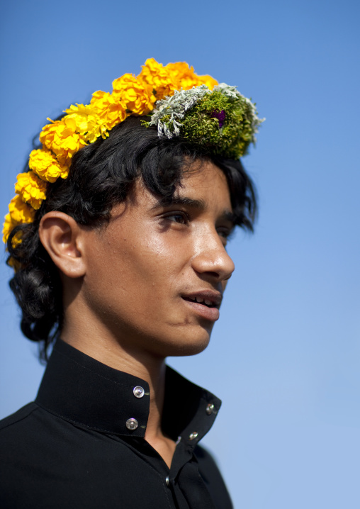 Portrait of a flower man wearing a floral crown on the head, Jizan province, Addayer, Saudi Arabia