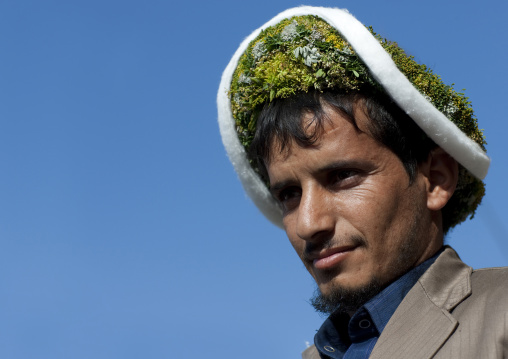 Portrait of a flower man wearing a floral crown on the head, Jizan province, Addayer, Saudi Arabia