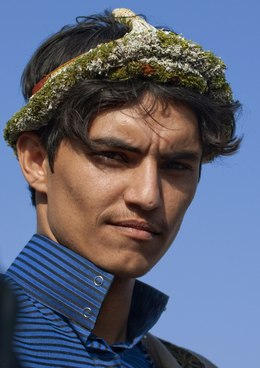 Portrait of a flower man wearing a floral crown on the head, Jizan province, Addayer, Saudi Arabia