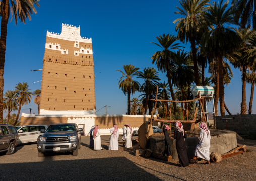 Well in front of a traditional mud-bricks house, Najran Province, Najran, Saudi Arabia