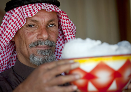 Saudi man drinking fresh camel milk, Riyadh Province, Riyadh, Saudi Arabia
