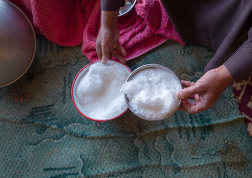 Saudi man offering fresh camel milk, Riyadh Province, Riyadh, Saudi Arabia