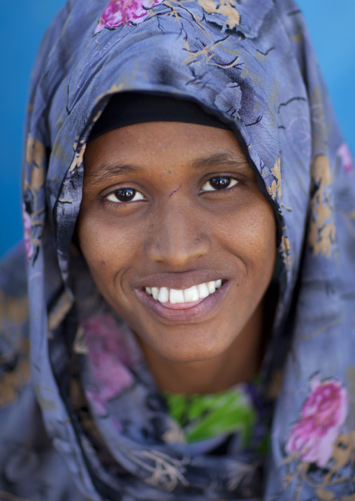Smiling Portrait Of A Beautiful Woman Wearing A Patterned Heardscarf, Boorama, Somaliland