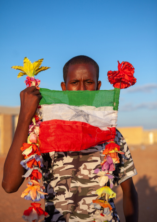 Portrait of a teenage boy with a national flag, Togdheer region, Burao, Somaliland