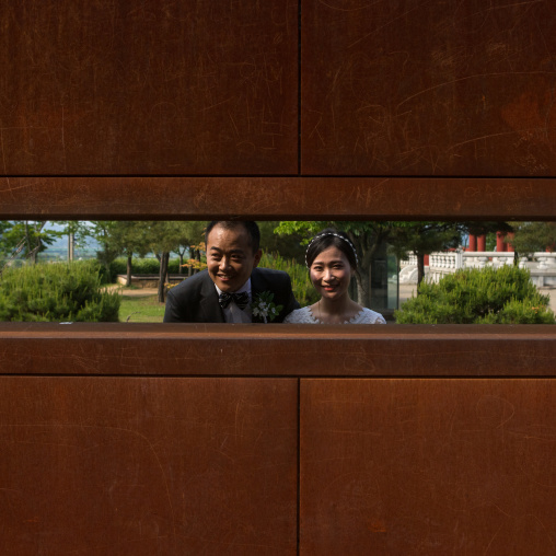 North korean defector joseph park taking a picture of his south korean fiancee juyeon on the north and south korea border, Sudogwon, Paju, South korea