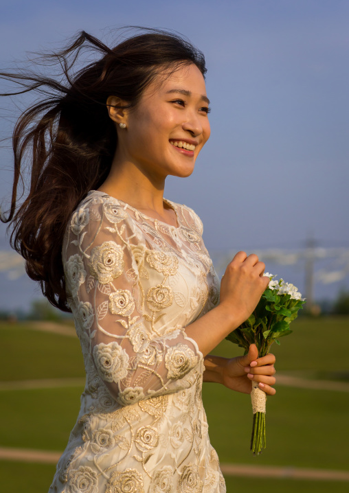 South korean woman called juyeon running in a wedding dress, Sudogwon, Paju, South korea
