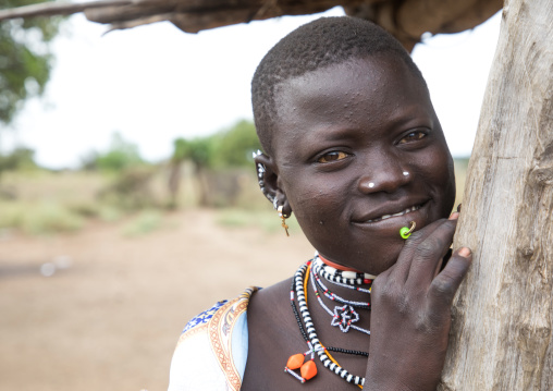 Portrait of a smiling Toposa tribe woman, Namorunyang State, Kapoeta, South Sudan
