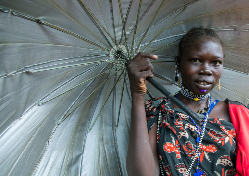 Portrait of a Toposa tribe woman with an umbrella, Namorunyang State, Kapoeta, South Sudan