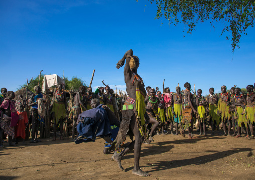 Toposa tribe women in traditional clothing dancing during a ceremony, Namorunyang State, Kapoeta, South Sudan