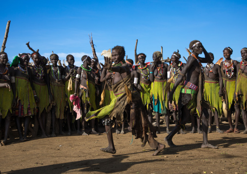 Toposa tribe women in traditional clothing dancing during a ceremony, Namorunyang State, Kapoeta, South Sudan