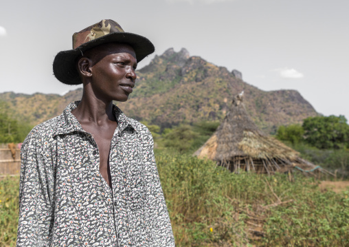 Portrait of a Larim tribe young man with a hat, Boya Mountains, Imatong, South Sudan