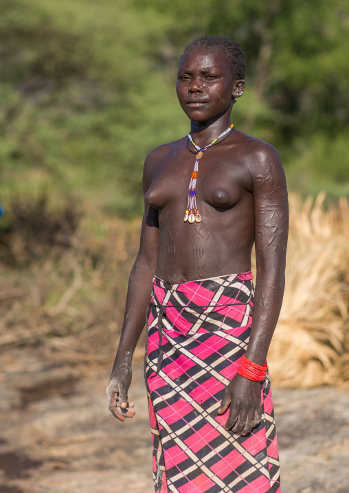 Portrait of a Larim tribe woman with scarifications on her body, Boya Mountains, Imatong, South Sudan