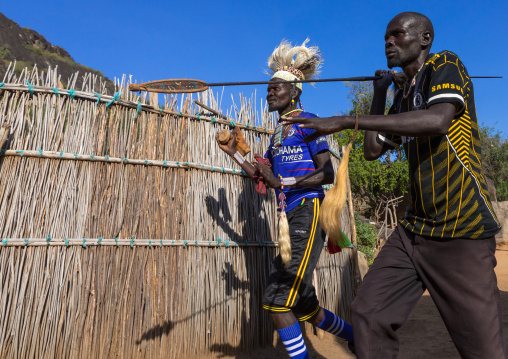 Larim tribe men dancing during a wedding ceremony, Boya Mountains, Imatong, South Sudan