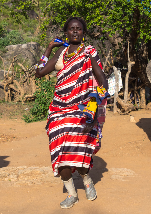Larim tribe woman dancing during a wedding celebration, Boya Mountains, Imatong, South Sudan