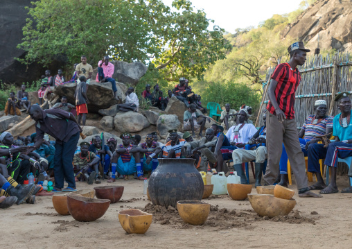 Larim tribe men drinking alcohol during a wedding ceremony, Boya Mountains, Imatong, South Sudan
