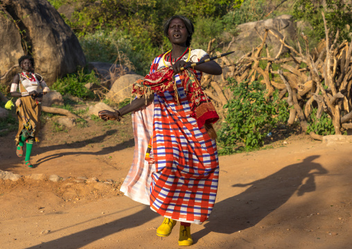 Larim tribe woman dancing during a wedding celebration, Boya Mountains, Imatong, South Sudan