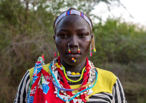 Portrait of a Larim tribe woman with traditional eaerrings and nose earrings, Boya Mountains, Imatong, South Sudan