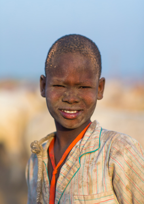 Portrait of a Mundari tribe boy covered in ash to repel flies and mosquitoes in a cattle camp, Central Equatoria, Terekeka, South Sudan