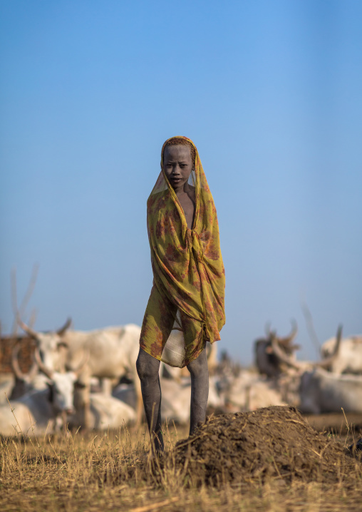 A Mundari tribe boy wrapped in blanket to fight the cold in a cattle camp, Central Equatoria, Terekeka, South Sudan