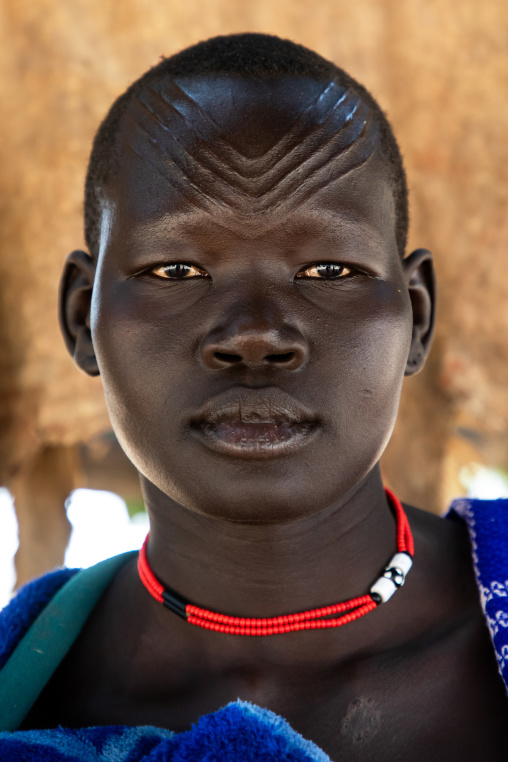Portrait of a Mundari tribe woman with scarifications on the forehead, Central Equatoria, Terekeka, South Sudan