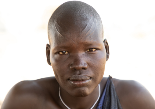 Portrait of a Mundari tribe woman with scarifications on the forehead, Central Equatoria, Terekeka, South Sudan