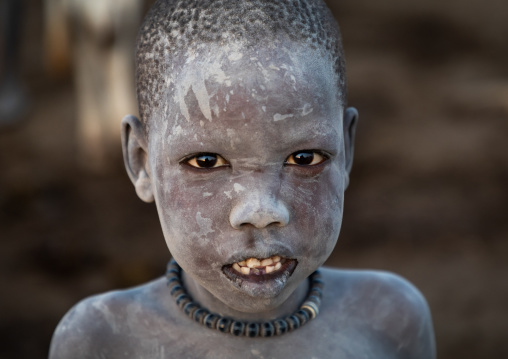 Mundari tribe boy covered in ash to protect from the mosquitoes and flies, Central Equatoria, Terekeka, South Sudan