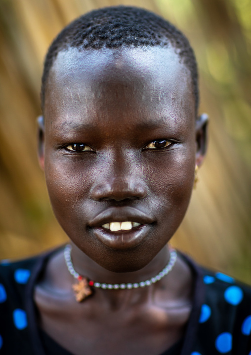 Portrait of a smiling Mundari tribe woman, Central Equatoria, Terekeka, South Sudan