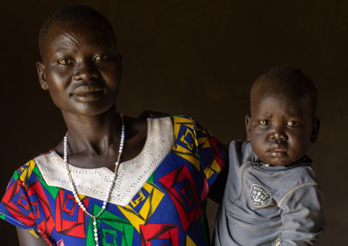 Portrait of a Mundari tribe mother with her child, Central Equatoria, Terekeka, South Sudan