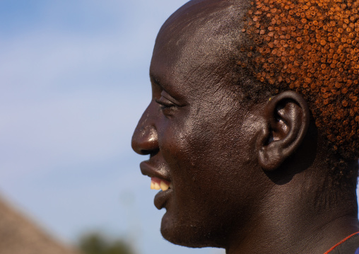 Portrait of a Mundari tribe man with hair dyed in orange with cow urine, Central Equatoria, Terekeka, South Sudan