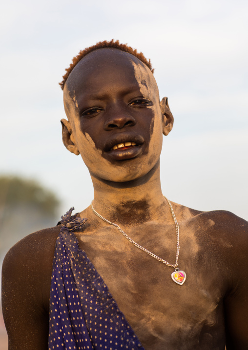 Mundari tribe boy covered in ash to protect from the mosquitoes and flies, Central Equatoria, Terekeka, South Sudan
