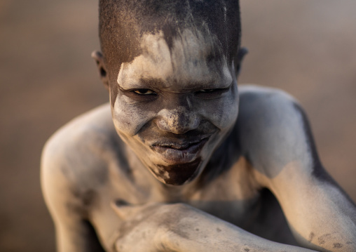 Mundari tribe boy covered in ash to protect from the mosquitoes and flies, Central Equatoria, Terekeka, South Sudan
