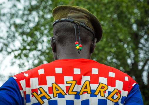 Portrait of a former soldier from Larim tribe wearing a chelsea football shirt, Boya Mountains, Imatong, South Sudan