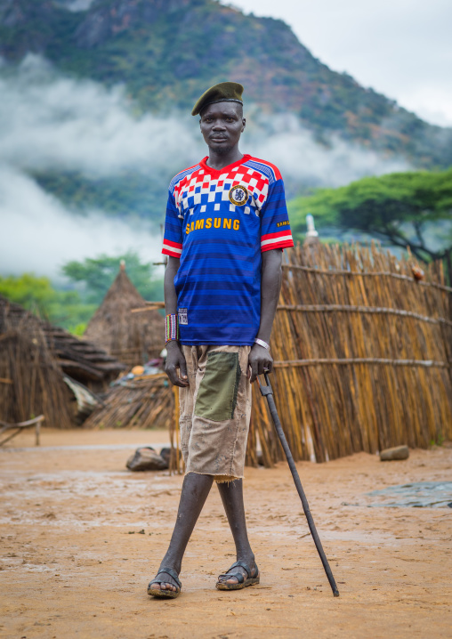 Portrait of a former soldier from Larim tribe wearing a chelsea football shirt, Boya Mountains, Imatong, South Sudan