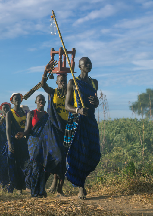 Mundari tribe women marching in line while celebrating a wedding, Central Equatoria, Terekeka, South Sudan