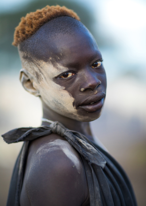 Mundari tribe boy covered in ash to protect from the mosquitoes and flies, Central Equatoria, Terekeka, South Sudan