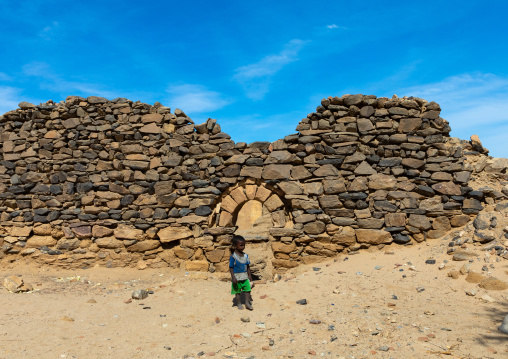 Sudanese child in gate in al Ghazali christian monastery, Northern State, Wadi Abu Dom, Sudan