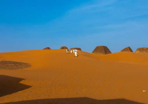 Sudanese tourists visiting the pyramids of the kushite rulers at Meroe, Northern State, Meroe, Sudan
