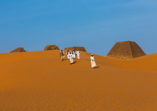 Sudanese tourists visiting the pyramids of the kushite rulers at Meroe, Northern State, Meroe, Sudan