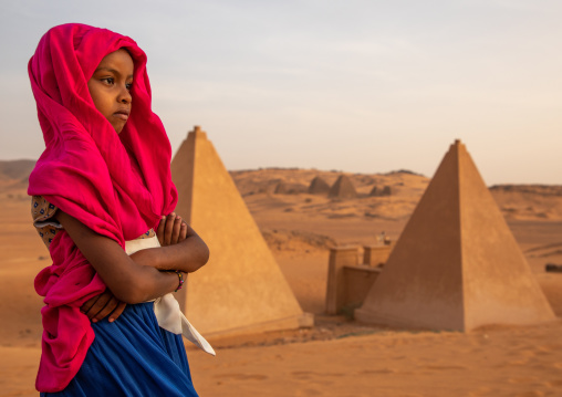 Portrait of sudanese girl visiting the pyramids of the kushite rulers at Meroe, Northern State, Meroe, Sudan